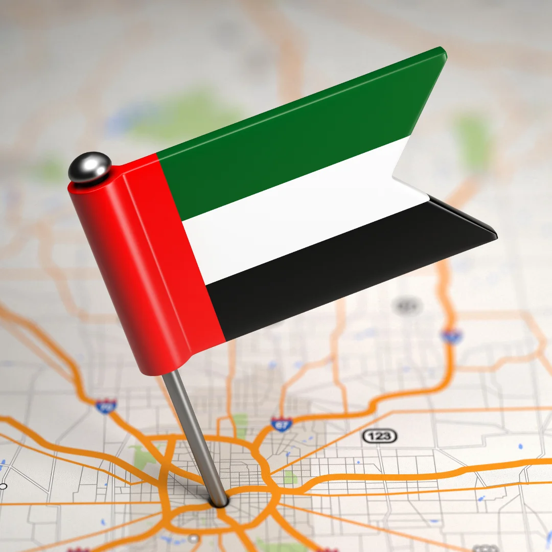 UAE flag pinned on a map, highlighting the location of the United Arab Emirates.